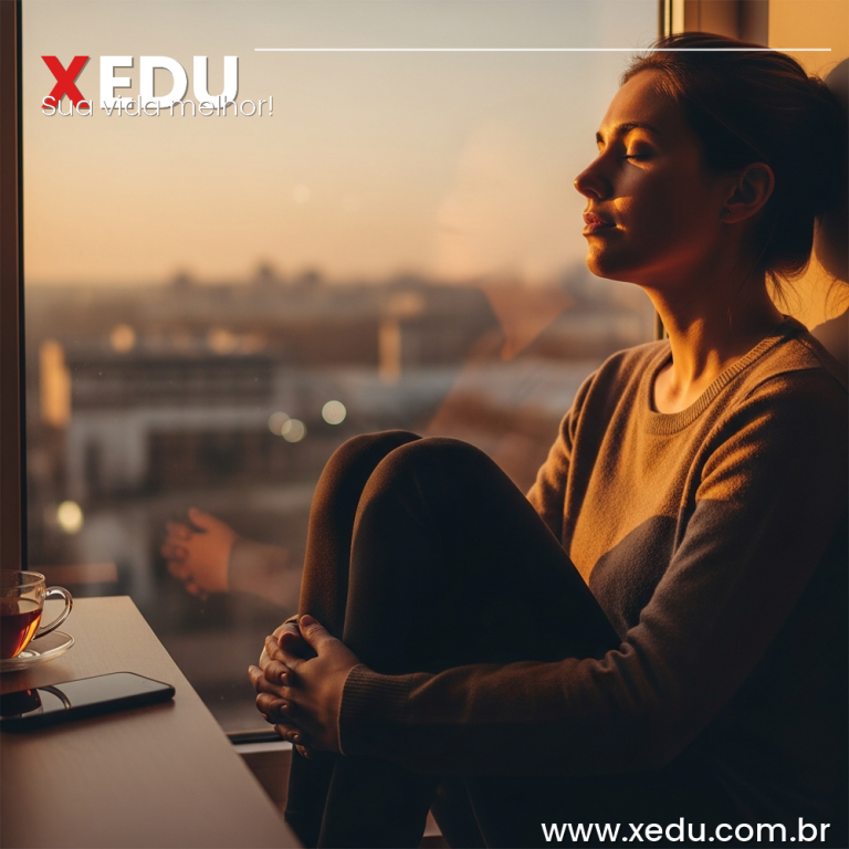 A serene person sitting by a window at golden hour, eyes closed, with a calm expression of inner peace. Outside the window, a blurred city with soft bokeh lights. On the table nearby, a smartphone face-down and a cup of tea. Warm amber tones, soft natural light, photorealistic, 16:9 format, no text.